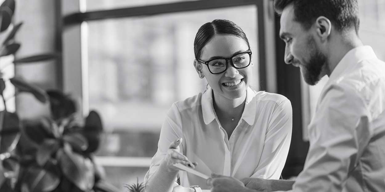 a friendly meeting between a male and female colleague