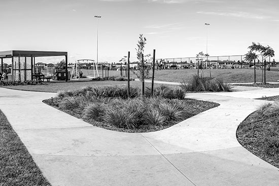 wide shot of a playground and surrounding landscaping