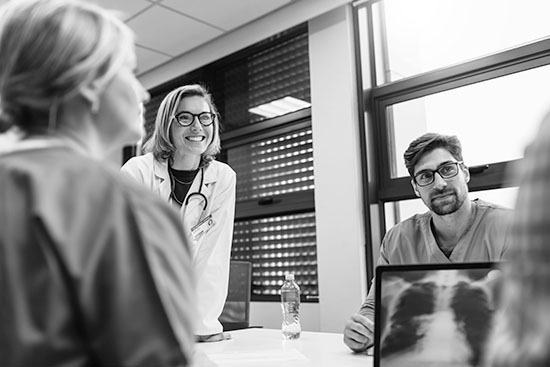 Doctors in a meeting with an image